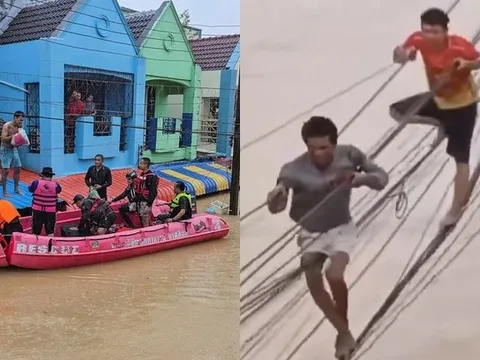 Bão lụt '300 năm có một': Phố thành sông, dân Thái Lan đu dây điện